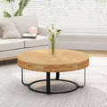 Table basse ronde sculptée en pin naturel et noir avec pieds en métal noir
